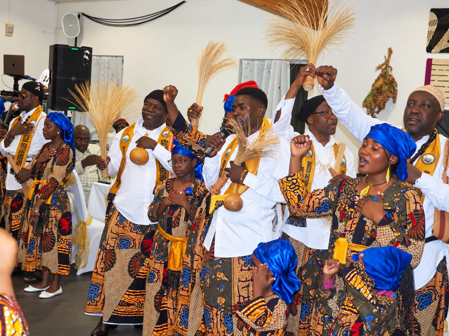 Community members celebrating in colourful traditional attire